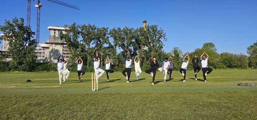 GQ United CC team practicing yoga and fitness training on the cricket field